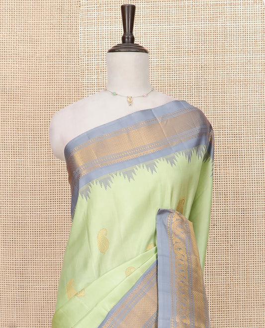 Pista Green Gadwal Saree Woven with Zari Paisley Buttas, a Contrast Temple Traditional Zari Design Border, Pallu of Jaal Design, and a Contrast Blouse with Zari Designs