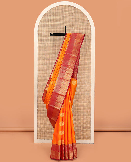 Orange Vasundhara Lite Silk Mix Saree Adorned with Zari Buttas, Featuring a Contrast Floral Zari Design Border, Zari Elevated Pallu of Muughal-Style Floral Designs, and a Contrast Blouse