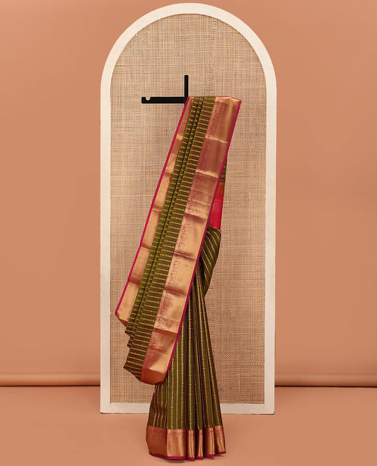 Green Vasundhara Lite Silk Mix Saree Decked Up with Zari Stripes, Complemented with a Contrast Border Featuring Rekku, Muthu, Kathir, and Mayil Designs, Pallu Replicates the Same Border Designs, and Paired with a Contrast Blouse