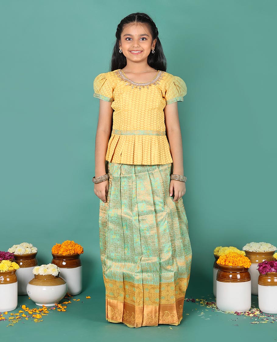 Green art silk readymade pavadai set, jacquard with contrast traditional zari border skirt, and contrast round neck embroidered puff-sleeve blouse