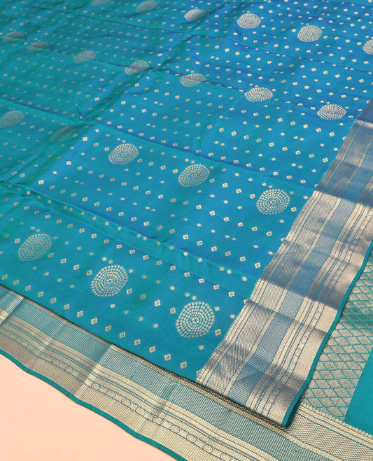 Blue Vasundhara Lite Silk Mix Saree, Adorned with Zari Buttas All Over Its Body, Highlighted by Traditional Zari Designs Woven Border, Grand Jaal Pallu and Paired with a Matching Blouse