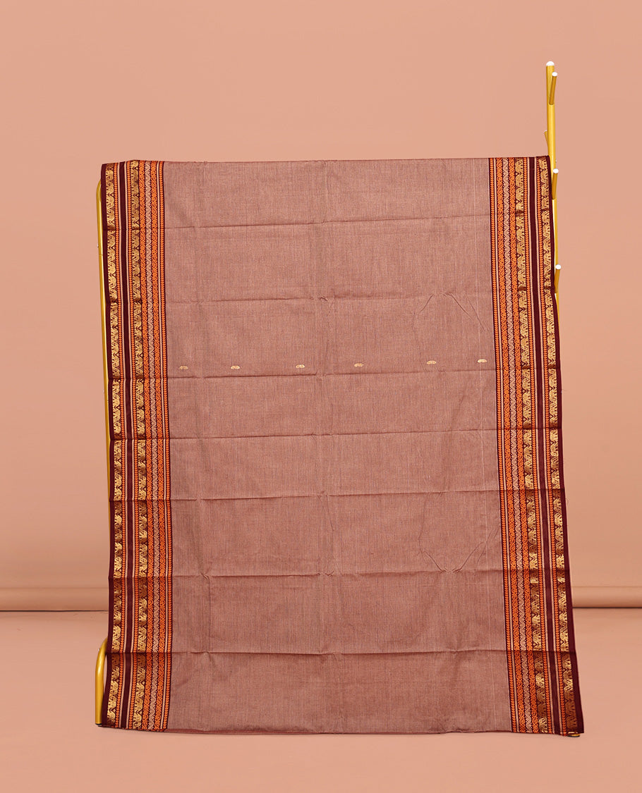 Brown Chettinad Cotton Saree, Subtly Sparkled with Buttas All Over Its Body, Complemented by a Contrast Traditional Zari Design Border, Pallu of Stripes and Buttas, and Paired with a Matching Blouse