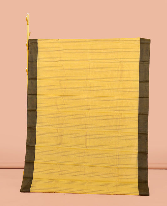 Yellow Semi-Silk Cotton Saree, Sparsely Sparkled with stripes All Over Its Body, complemented by a Contrast Border, Striped Pallu, and Paired with a Matching Blouse