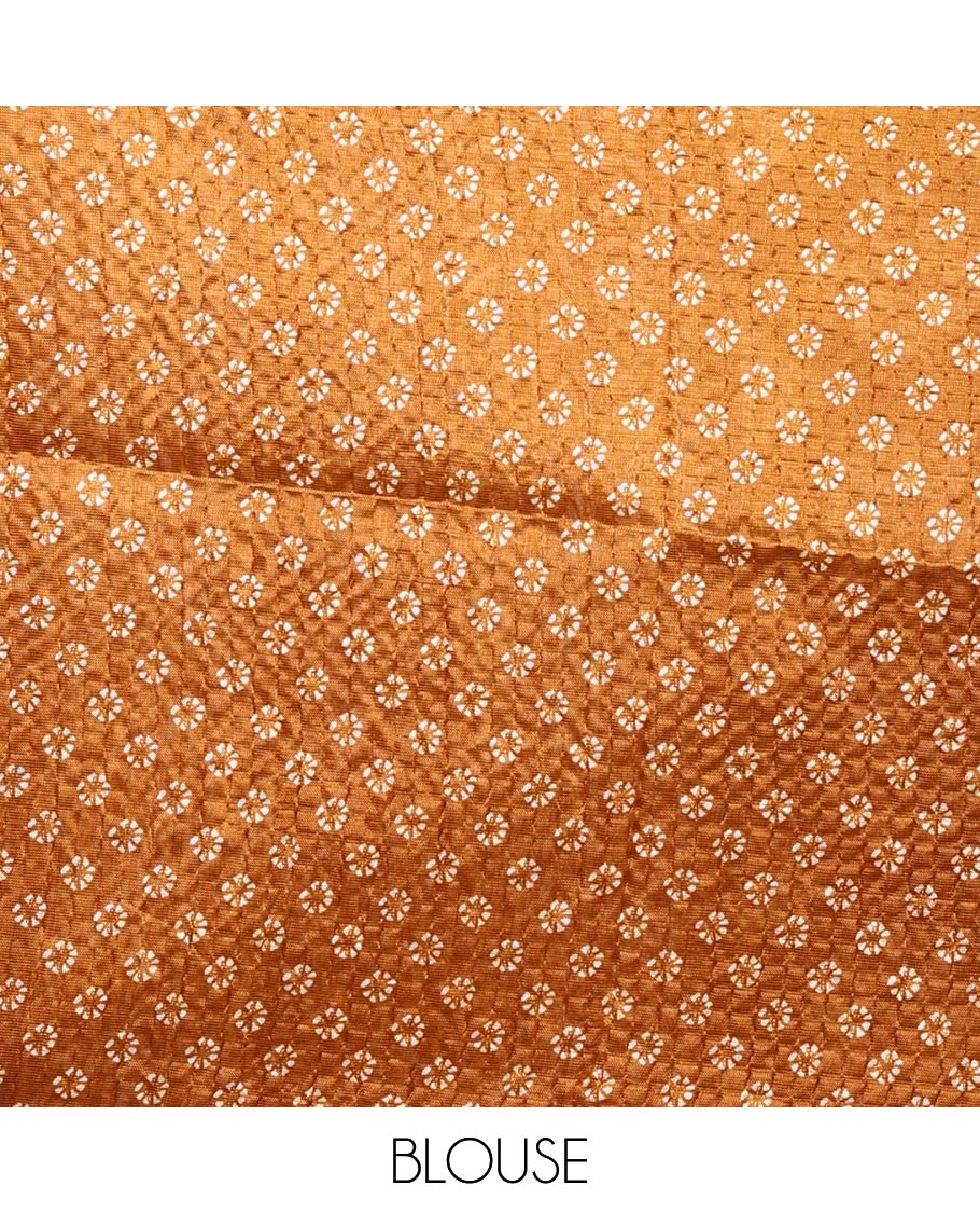 Gold batik-style tree motif printed litch crushed saree, leaf print border, floral-geometric print pallu & floral print blouse