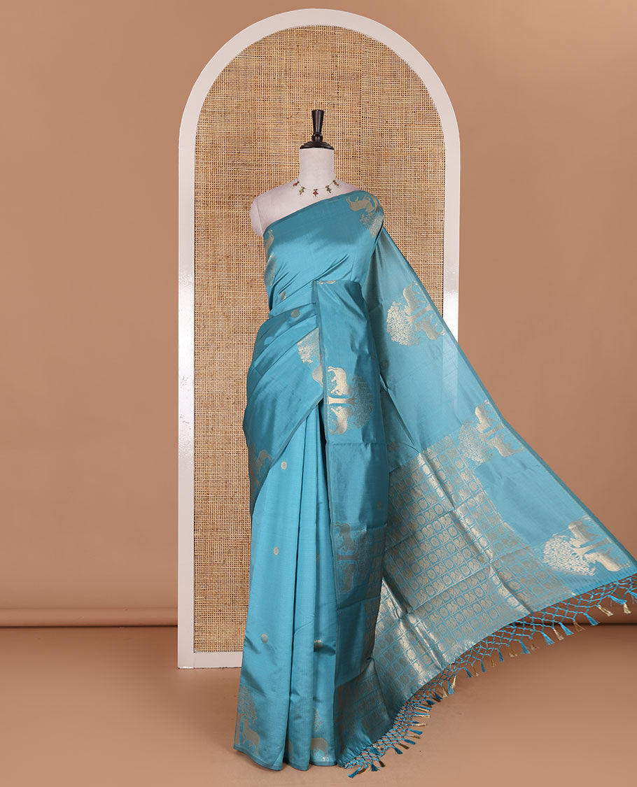 Borderless sky blue peacock, chakra, and pichwai cow buttas zari woven kanchi silk saree, peacock and chakra enclosed checked pallu, and matching blouse