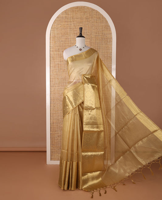 Gold sparsely checks Banaras tissue saree, big zari border of thilakam mokku, leaf motif & floral creeper & zari design blouse