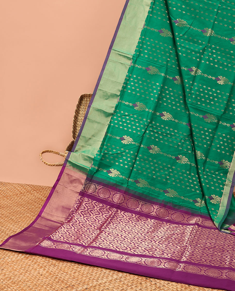 Green kupadam cotton saree with buttas, plain border & contrast pallu of ogee patterns