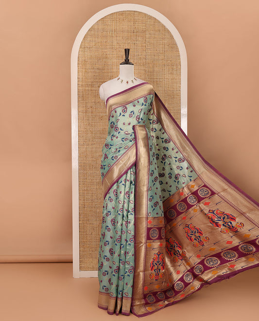 Sea green floral & paisley vine tissue silk saree, contrast temple border, paithani-style peacock & muniya pallu & contrast zari buttas blouse