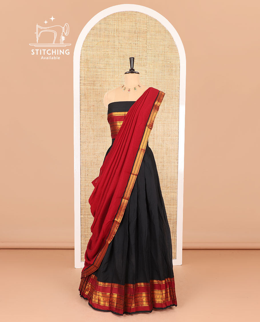 Black half-saree, plain with contrast varisai pettu traditional zari bordered skirt, matching blouse and a plain zari border contrast dhavani