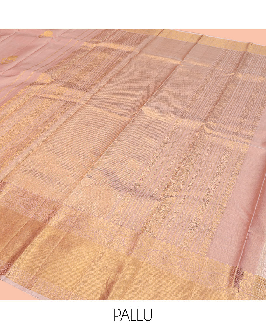 Rose Gold Kanchipuram Silk Saree, Delicately Woven with Floral Buttas All Over Its Body, Highlighted by Zari Border of Thilakam Mokku, Neli, Poun, and Kodi Visiry Designs, Gleaming Pallu, and Paired with a Matching Blouse