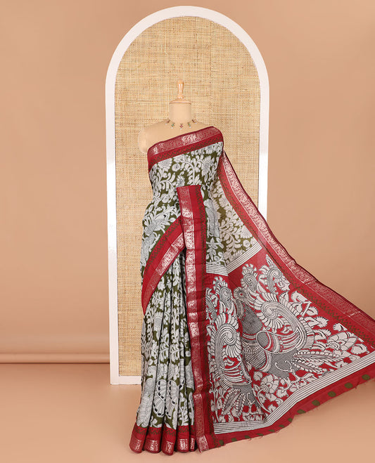 Olive kalamkari floral vine and peacock printed muslin cotton saree, contrast zari border, kalamkari peacock printed pallu, and a contrast coin buttas printed blouse