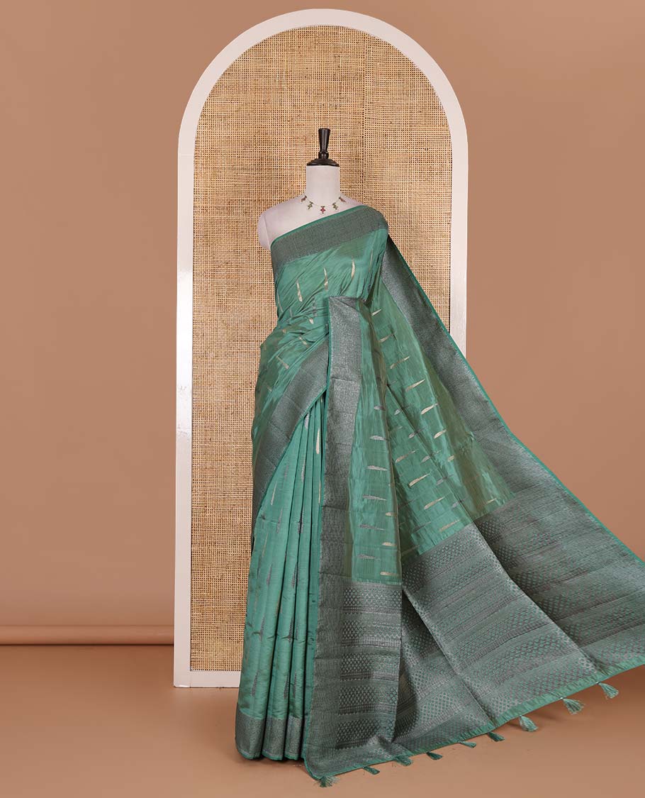 Green buttas woven semi-tussar saree, zari border, geometric patterned pallu, and a matching blouse