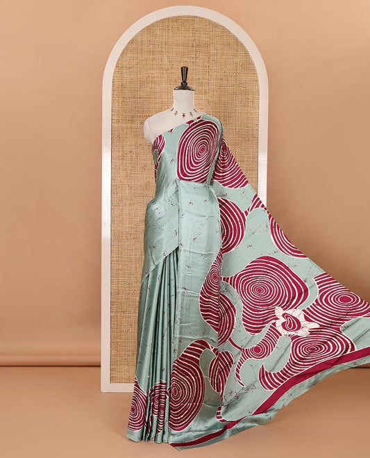 Borderless green batik-style spiral printed satin crepe saree, printed pallu & matching printed blouse