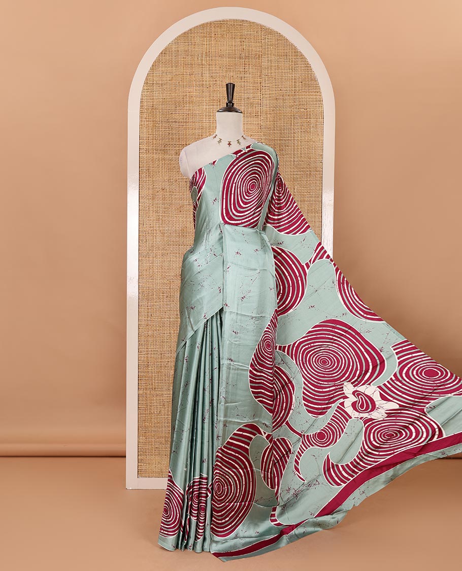 Borderless green batik-style spiral printed satin crepe saree, printed pallu & matching printed blouse