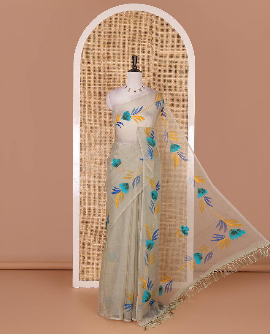 Borderless pista green floral motifs  hand brush painted semi-organza saree comes with tasseled pallu and without blouse