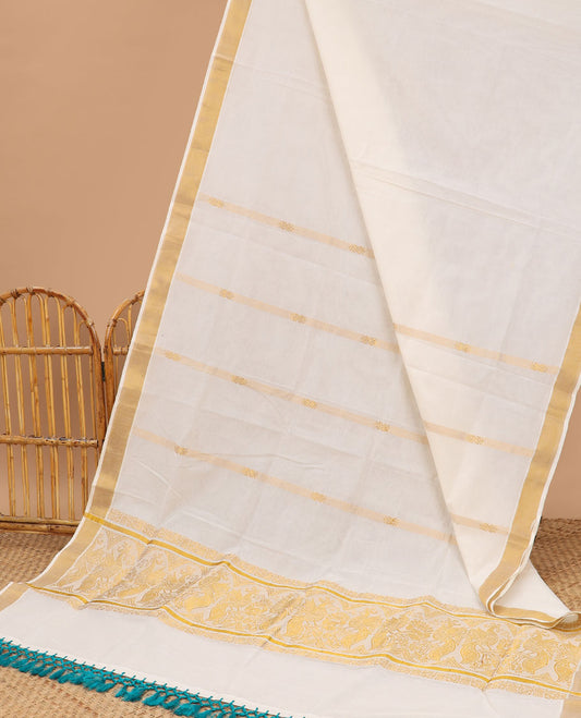 Cream kerala saree with zari stripes, zari border & pallu of peacock designs in zari