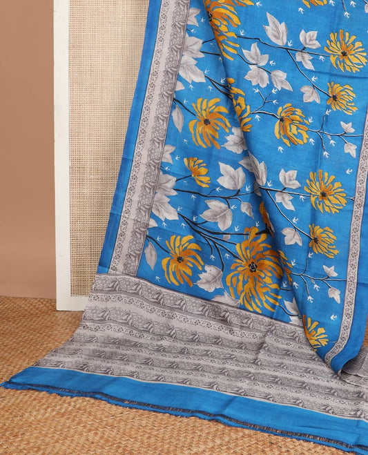 Light blue floral printed silk saree with contrast floral border & floral design pallu