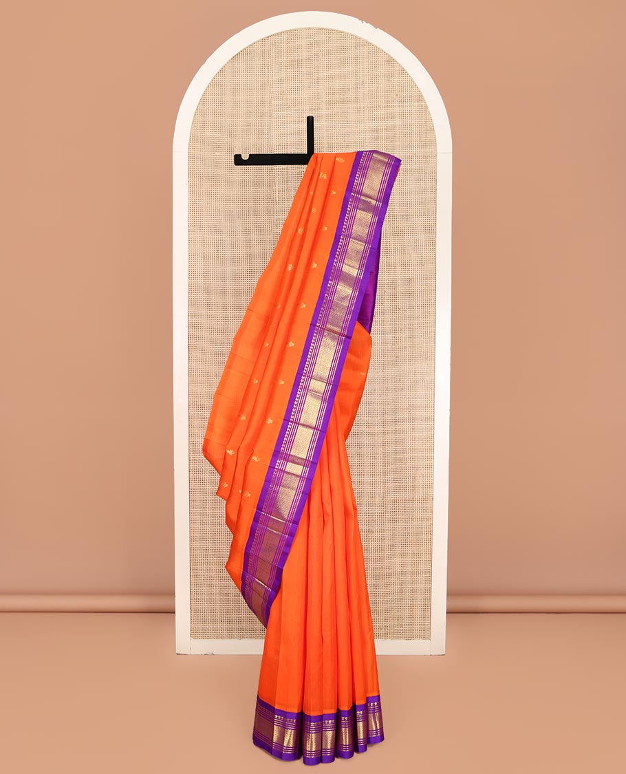 Orange Kanchipuram Silk Saree, Decked Up with Zari Buttas on Its Body, Complemented by a Contrast One-Sided Korvai Border of Panner Sombu, Banaras, Muthu, and Mayil Kann Designs, Pallu Features Zari Designs, and Comes Without a Blouse