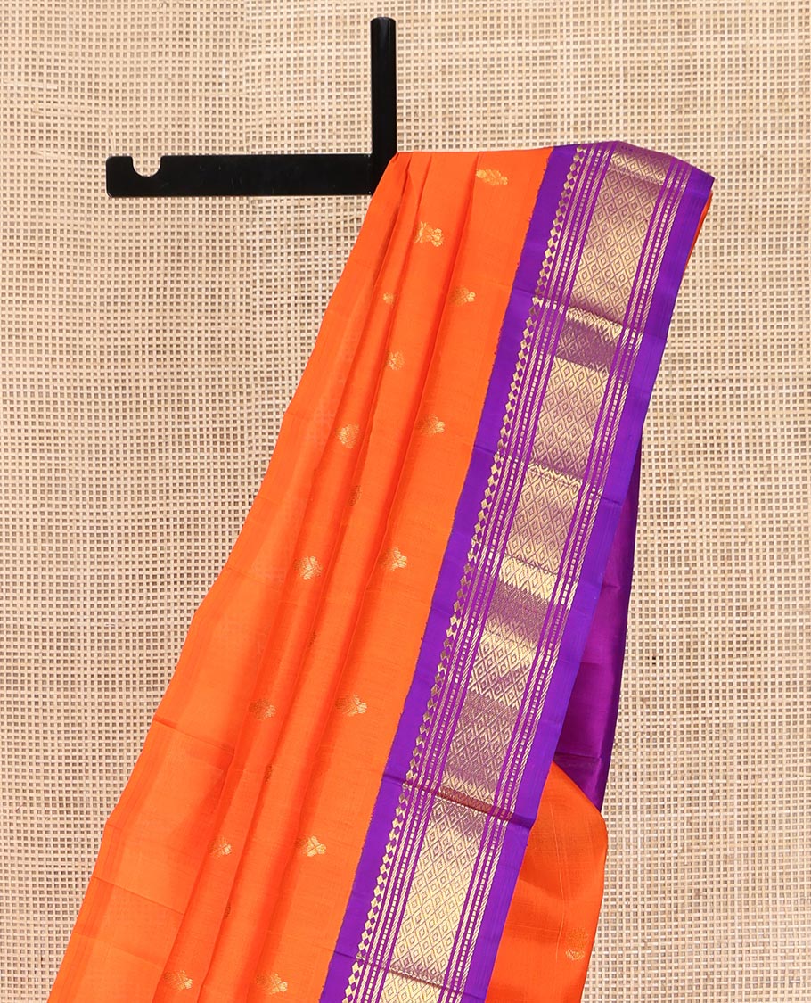 Orange Kanchipuram Silk Saree, Decked Up with Zari Buttas on Its Body, Complemented by a Contrast One-Sided Korvai Border of Panner Sombu, Banaras, Muthu, and Mayil Kann Designs, Pallu Features Zari Designs, and Comes Without a Blouse