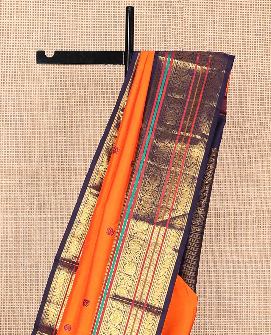 Orange annam chakram buttas Kanchipuram korvai silk saree, contrast rettai pettu korvai border of rekku, banaras, muthu, and chakram designs, and poun design steeped pallu