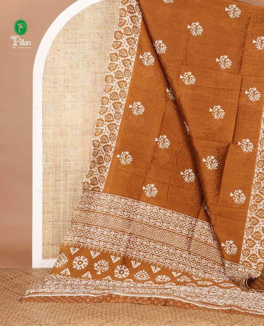 Gold batik-style tree motif printed litch crushed saree, leaf print border, floral-geometric print pallu & floral print blouse
