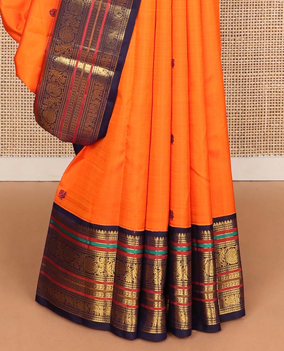 Orange annam chakram buttas Kanchipuram korvai silk saree, contrast rettai pettu korvai border of rekku, banaras, muthu, and chakram designs, and poun design steeped pallu