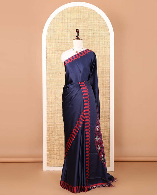 Navy blue plain gajji silk saree features a temple-printed border, a circular-shaped vine-patterned pallu, and a unique motif-printed blouse