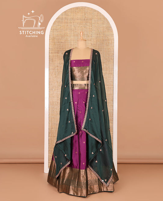Violet taffeta silk half-saree, flower zari buttas and contrast traditional zari bordered skirt, a matching blouse, and contrast embroidered satin georgette scallop dhavani