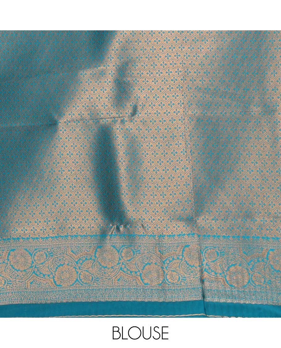 Borderless chikku-blue zari buttas & half-&-half vanasingari-style flora-fauna woven kanchi silksaree,self-pallu & blue blouse of zari brocade