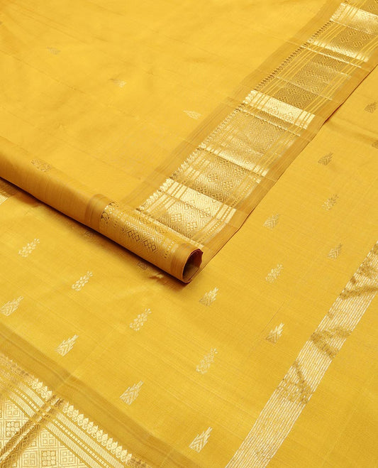 Mustard buttas kancheepuram silk saree with contrast border of thilakam mokku, banaras, muthu,checked design & zari design pallu