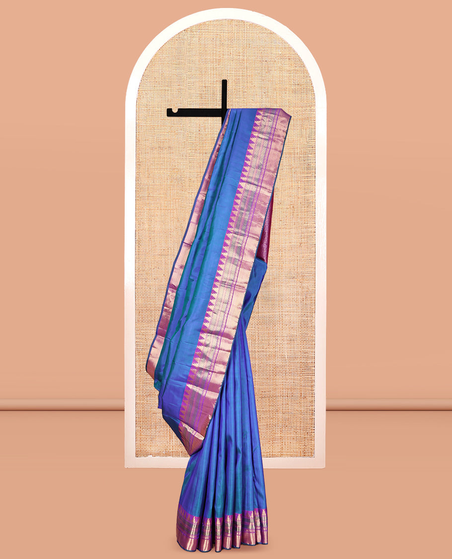 Blue Plain Kanchipuram Silk Saree, Complemented by a Contrast Border of Thazampoo Rekku, Banaras, Muthu, and Kodi Visiry Designs, Mayil Kann Pallu, and a Contrast Blouse