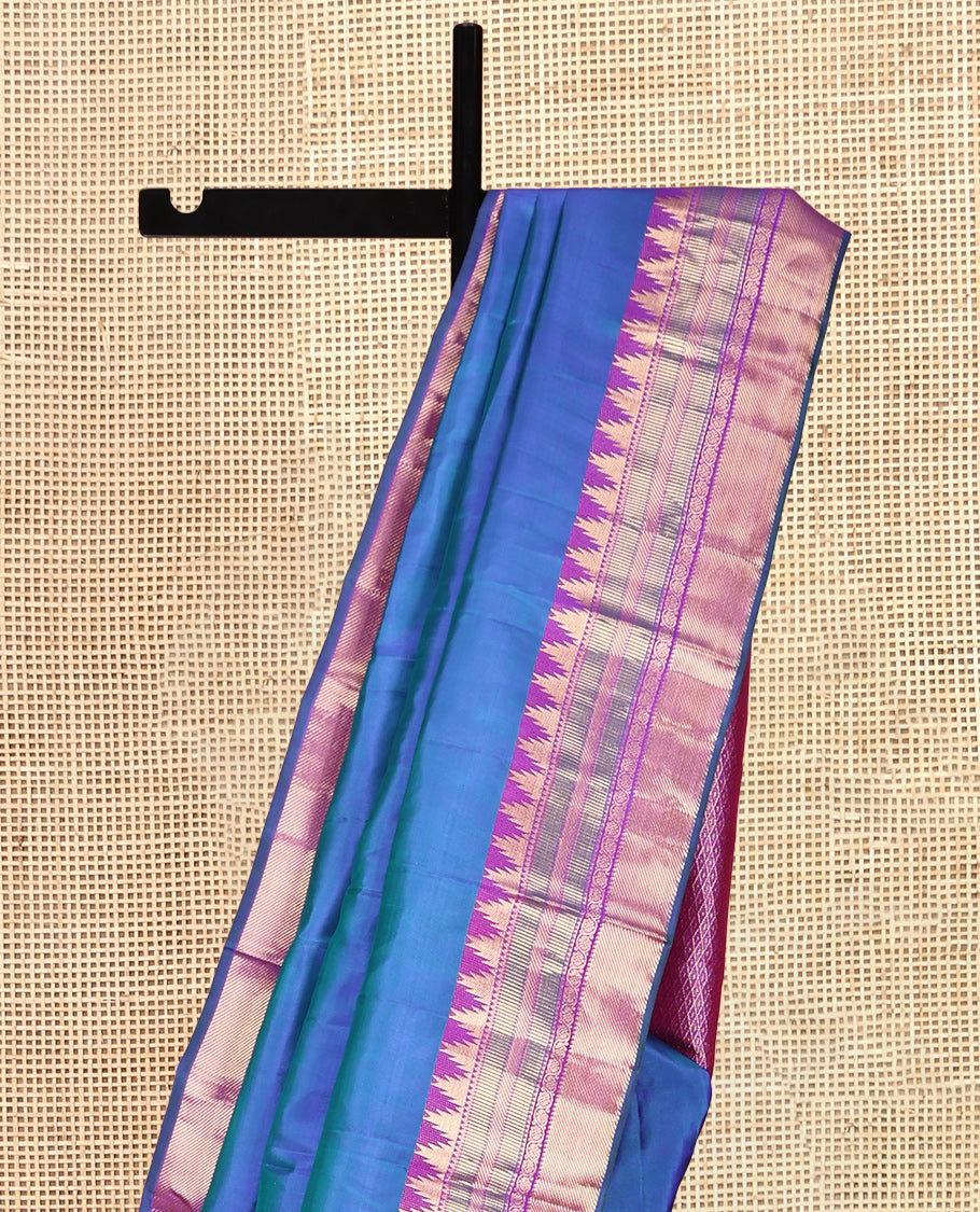 Blue Plain Kanchipuram Silk Saree, Complemented by a Contrast Border of Thazampoo Rekku, Banaras, Muthu, and Kodi Visiry Designs, Mayil Kann Pallu, and a Contrast Blouse