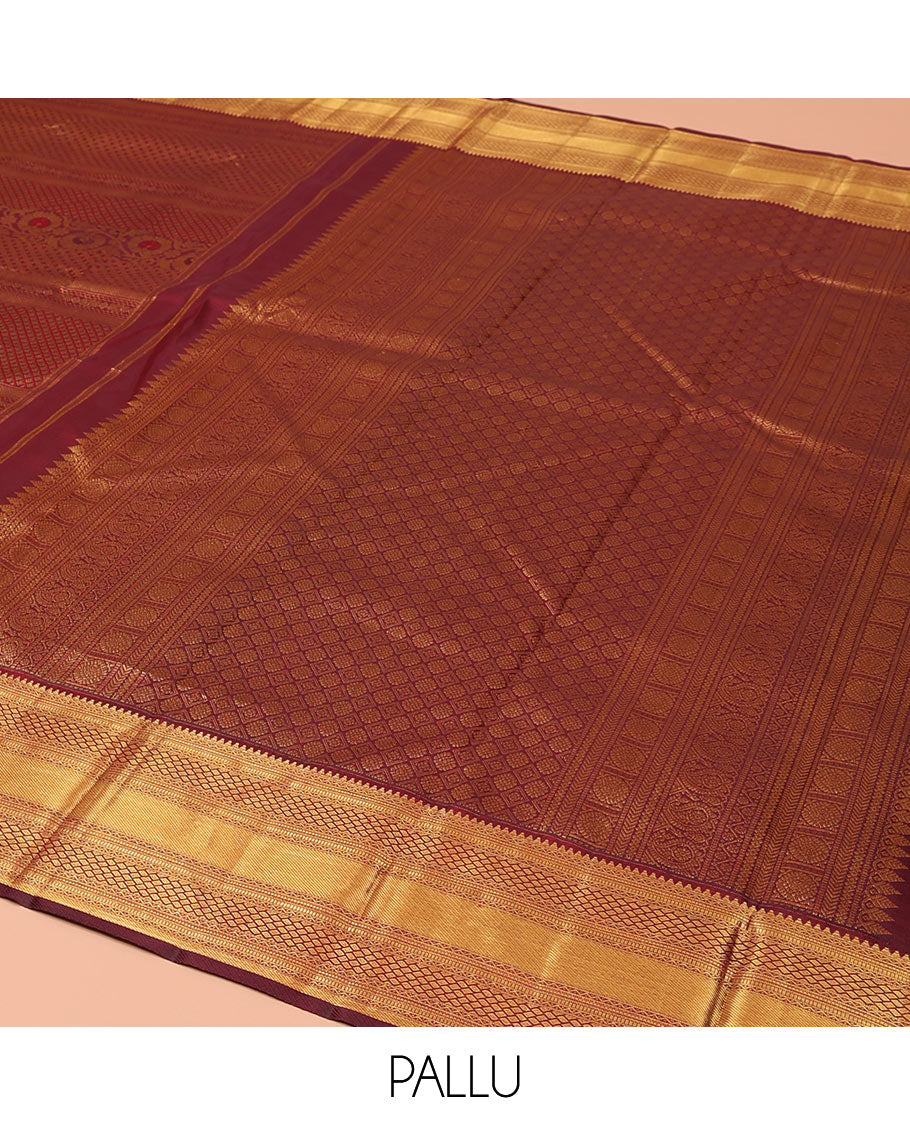 Maroon Kanchipuram Wedding Silk Saree, Gracefully Embellished with Floral Creeper Jacquard Design on Its Body, Highlighted by Zari Border of Rekku, Muthu, Neli, Zari Strips, and Jaal Designs, Grand Pallu, and Paired with a Matching Blouse