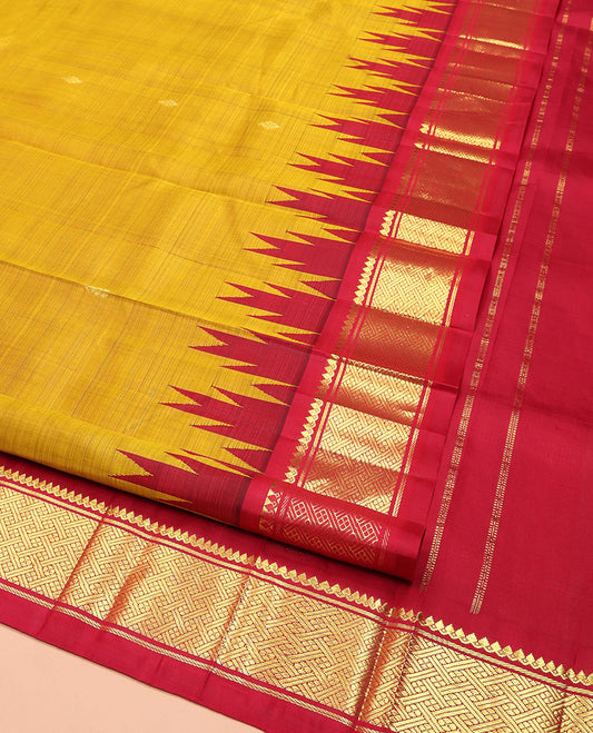 Yellow Kanchipuram Silk Saree, Accentuated with Zari Buttas on Its Body, Complemented by Contrast One-Sided  Thazampoo Rekku Border of Thilakam Mokku, Banaras, and Jaal Designs, Pallu of Zari Designs, and Comes Without a Blouse