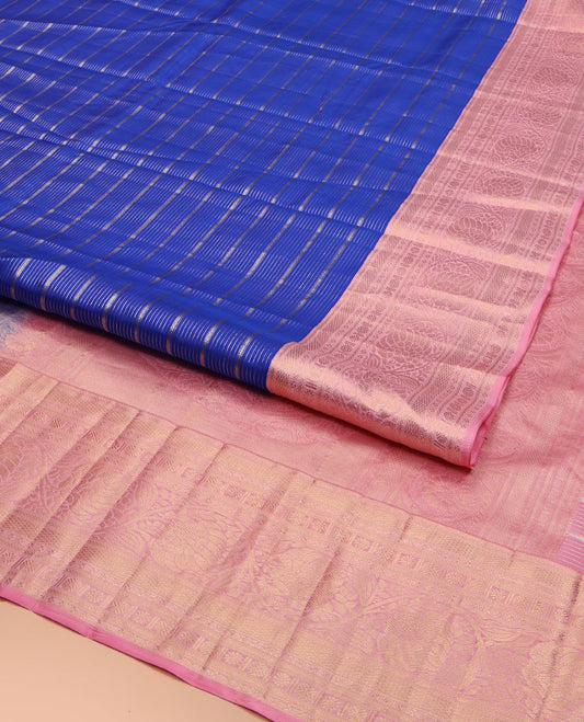 Blue Vasundhara Silk Saree, Beautifully Embellished with Zari Stripes All Over Its Body, Complemented by Contrast Border of Mayil Kann, Rudraksham, and Kodi Visiry Designs, Intricately Designed Pallu, and Paired with a Contrast Blouse