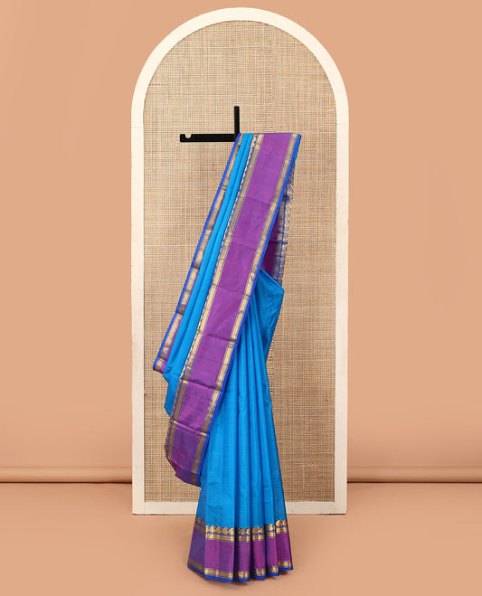 Blue striped Kanchipuram silk saree, contrast rettai pettu border of manga, and mayil kann designs, and zari design pallu