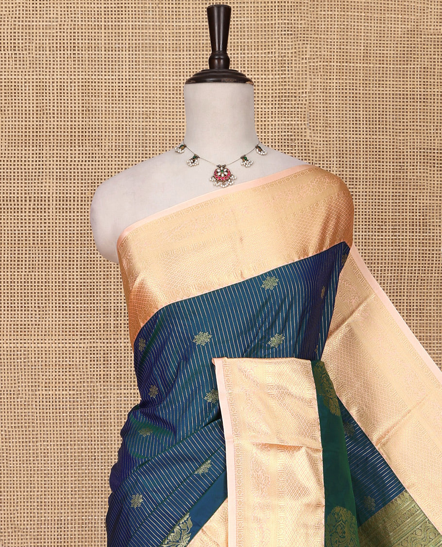 Blue Budget Silk Saree, Detailed with Zari Buttas, Stripes and Paisleys on Its Body, Complemented by a Contrast Traditional Zari Design Border, Opulently Embellished Pallu, and Paired with a Contrast Blouse