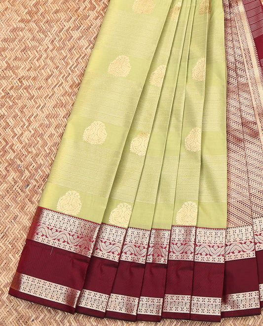 Green Budget Silk Saree, Dazzled with Zari Buttas and Stripes All Over Its Body, Complemented by a Contrast Traditional Zari Design Border, Contrast Pallu of Diagonal Designs, and Paired with a Contrast Blouse
