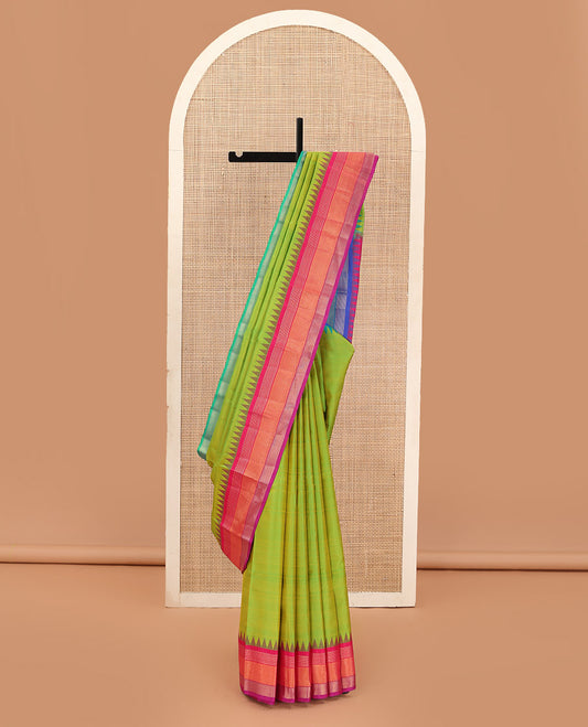 Green striped Bangalore silk saree, contrast ganga jamuna temple border, and temple design pallu