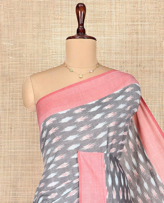 Grey Ikkat Cotton Saree, Adorned with Ikkat-Style Buttas on Its Body, Complemented by Contrast Border, Pallu of Chevron Stripes, and Has No Blouse