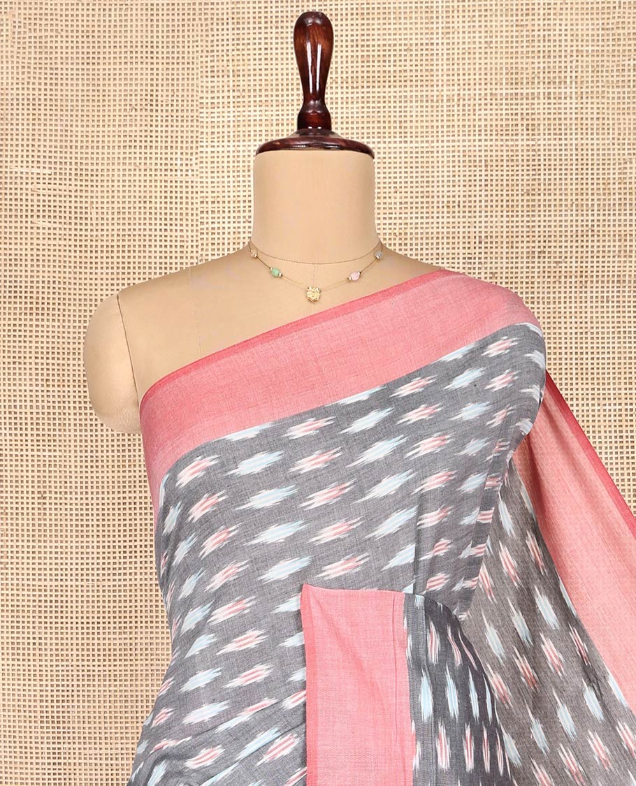 Grey Ikkat Cotton Saree, Adorned with Ikkat-Style Buttas on Its Body, Complemented by Contrast Border, Pallu of Chevron Stripes, and Has No Blouse