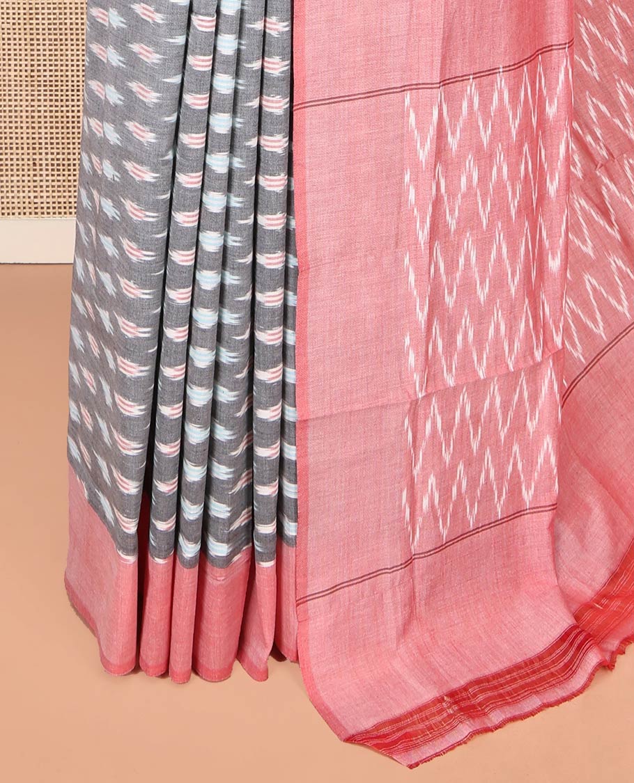 Grey Ikkat Cotton Saree, Adorned with Ikkat-Style Buttas on Its Body, Complemented by Contrast Border, Pallu of Chevron Stripes, and Has No Blouse