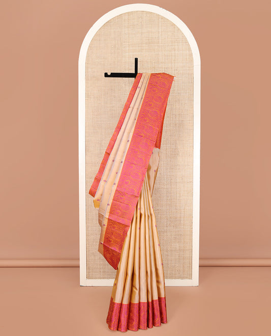 Sandal Kanchipuram Silk Saree, Embellished with Mayil- Chakram Buttas All Over Its Body, Complemented by a Contrast Border of Thilakam Mokku, Kathir, and Mayil Enclosed Arumbu Manga Designs, Subtly Jaal Pallu, and Paired with a Contrast Blouse