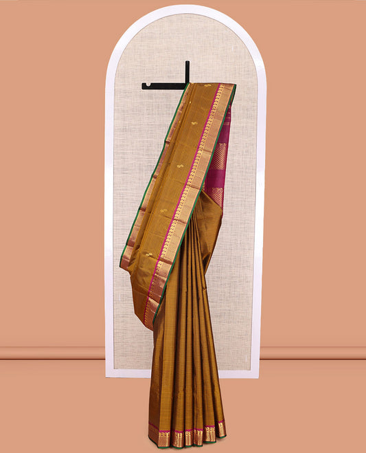 Brown Kanchipuram Silk Saree, Elevated with Vazhaipoo Stipes and Zari Buttas, a Contrast Ara Madam and Manga Motif Border, Pallu of Zari Design, and Contrast Blouse