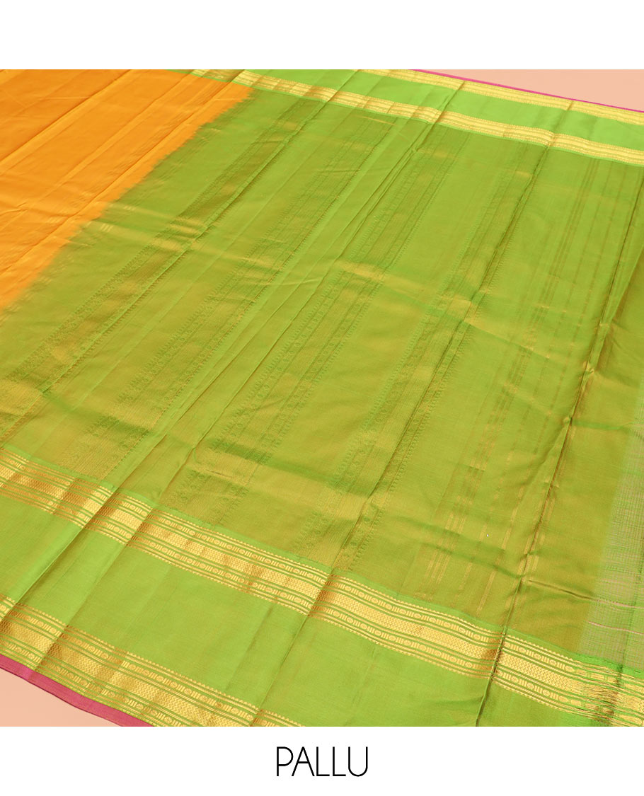 Orange Plain Kanchipuram Silk Saree Accentuated by a Contrast Rettai Pettu Border Featuring Rekku, Banaras, Rudraksham, and Vanki Designs, with a Subtly Zari-Woven Pallu, Paired with a Contrast Blouse
