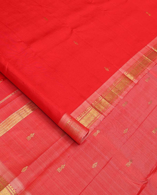 Red Kanchipuram Silk Saree, Accentuated with Zari Buttas All Over Its Body, Complemented by Contrast One-Sided Border of Rekku, Banaras, and Mayil Kann Designs, Pallu of Zari Designs, and Comes Without a Blouse