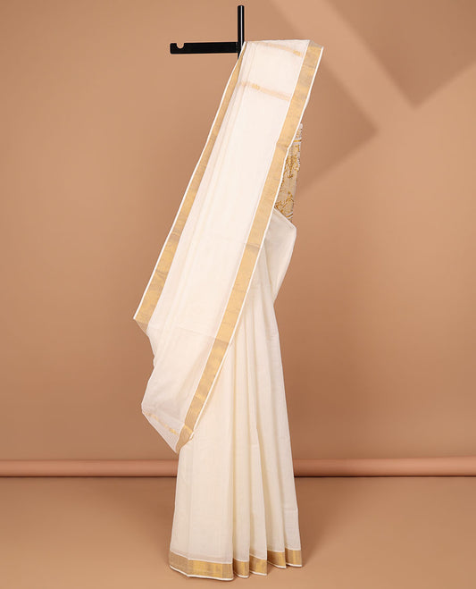 Cream kerala saree with zari stripes, zari border & pallu of peacock designs in zari