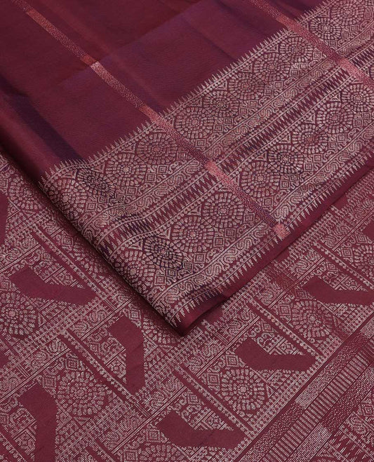 Maroon zari striped soft silk saree, zari border of ara bogudi and chakram designs, and intricately decked up pallu