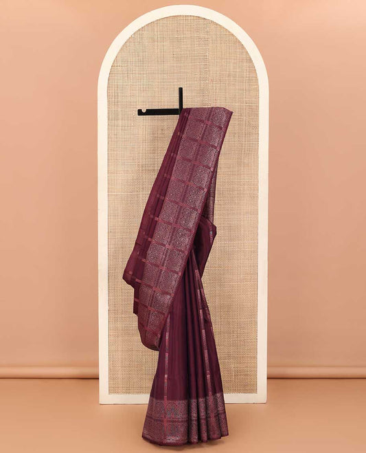 Maroon zari striped soft silk saree, zari border of ara bogudi and chakram designs, and intricately decked up pallu