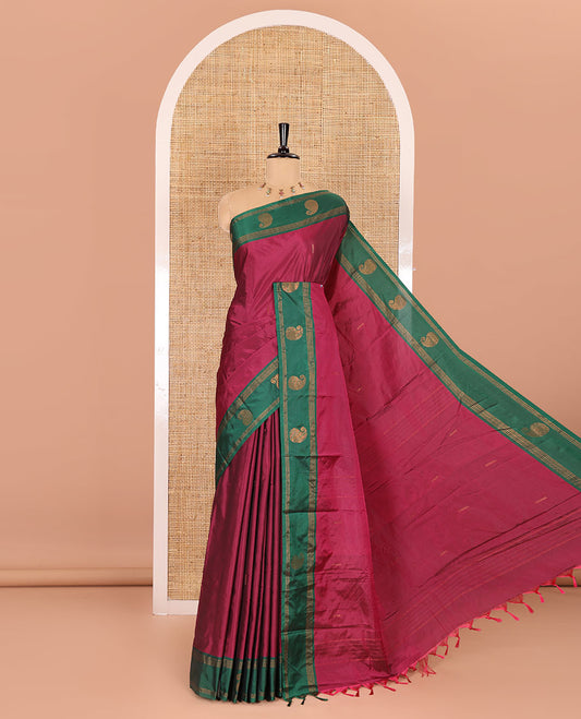 Purple zari buttas semi-soft silk saree, contrast border of stripes, and paisley buttas, zari buttas pallu, and a matching blouse